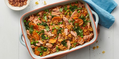Baking dish filled with cheat’s biryani made from Sealord lemon pepper tuna, rice, peas, carrots, and herbs—served as a colourful, hearty meal.