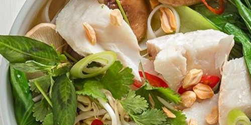 Bowl of Vietnamese-style pho soup made with Sealord canned tuna, fresh herbs, noodles, and vegetables.