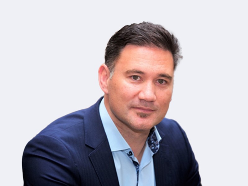 Tuuta the company’s new Board chair from wearing a light blue shirt and navy blazer posing in front of a white background